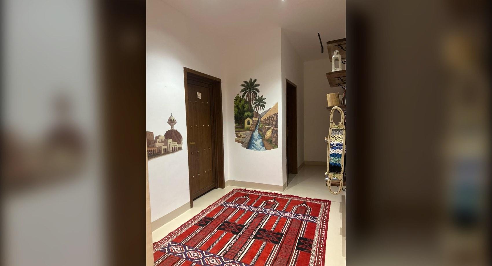Corridor with hand-painted Omani murals